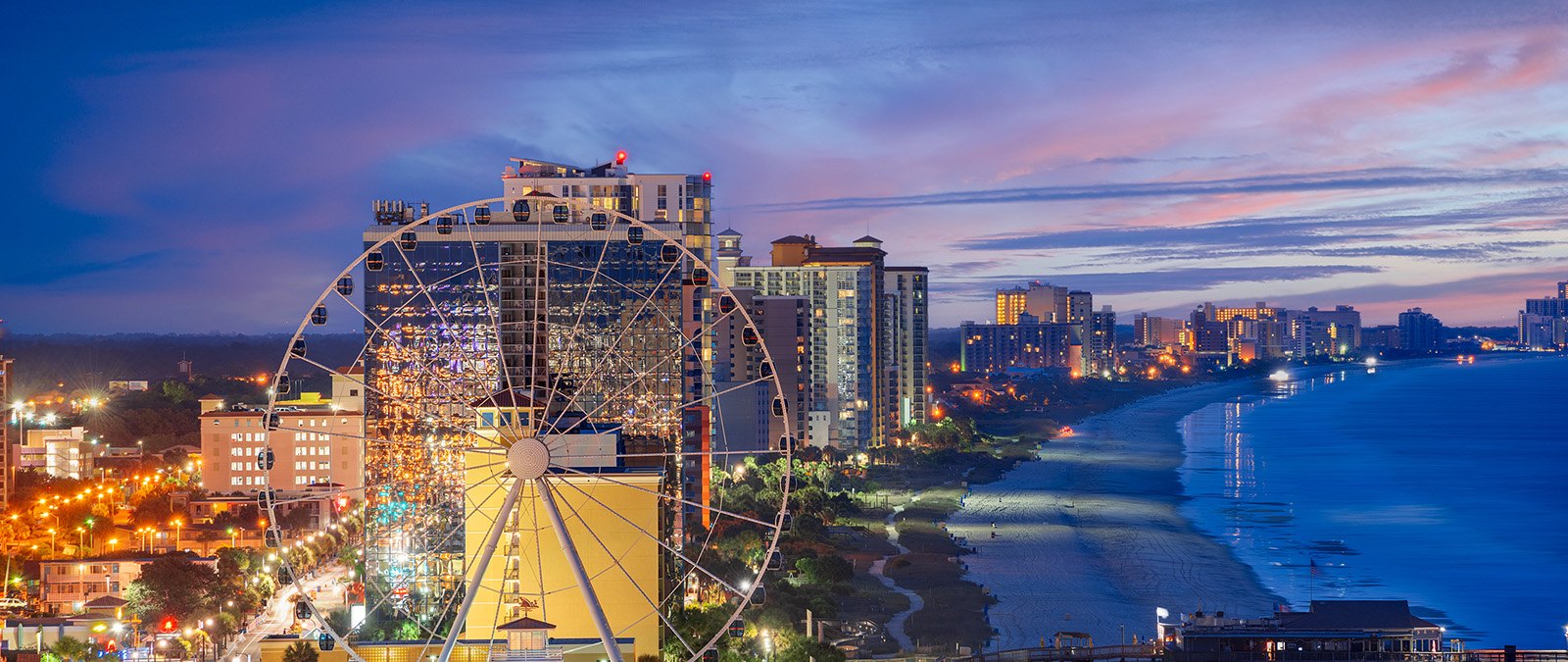 Myrtle Beach SkyWheel and coastline at dusk in South Carolina