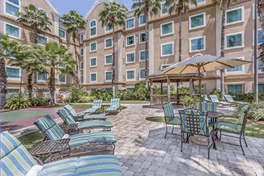 Courtyard and outdoor seating at Hawthorn Suites Orlando Lake Buena Vista